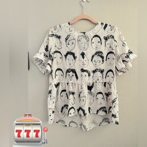 White and black blouse with prints of various faces, size L but it looks like M
